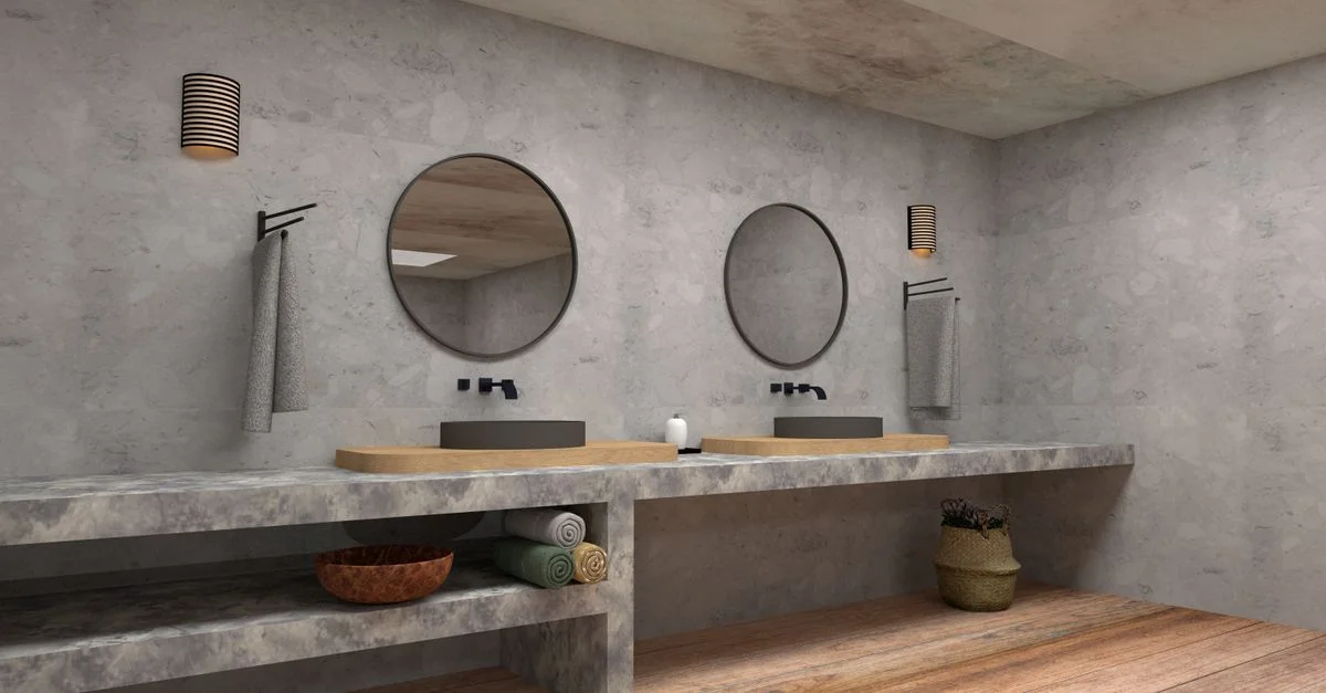 Intérieur de salle de bain élégant avec lavabos doubles, miroirs ronds et décor minimaliste.